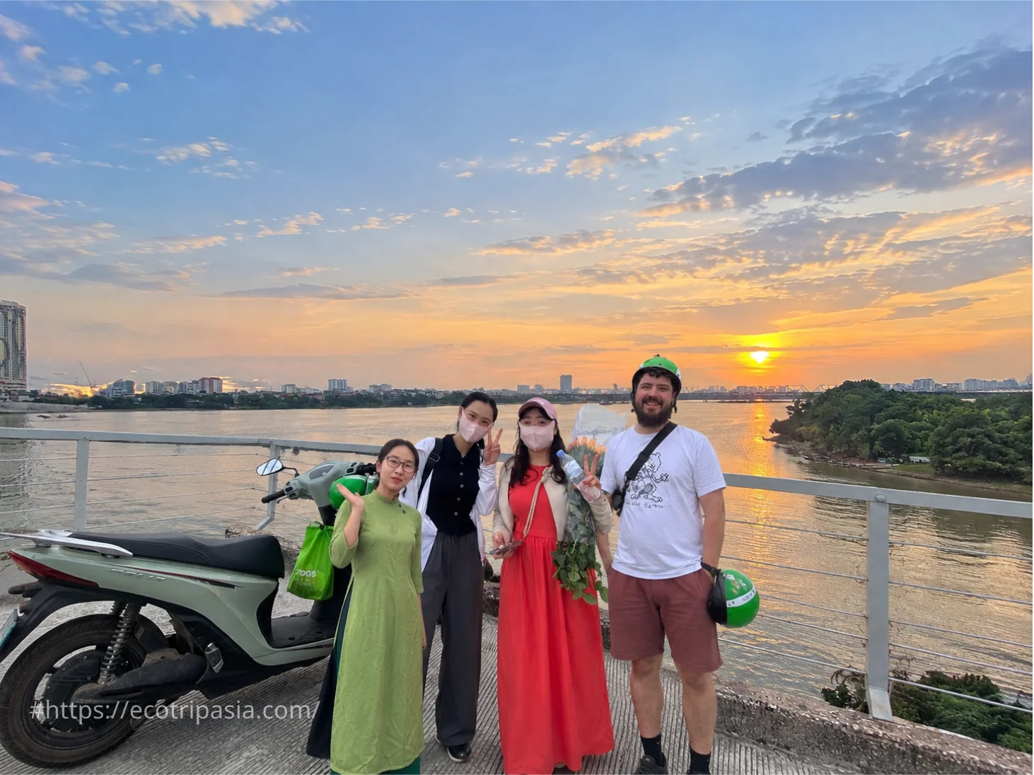 Electric Scooters Crossing Long Bien Bridge — hanoi street food tour with female riders by Eco Trip Asia