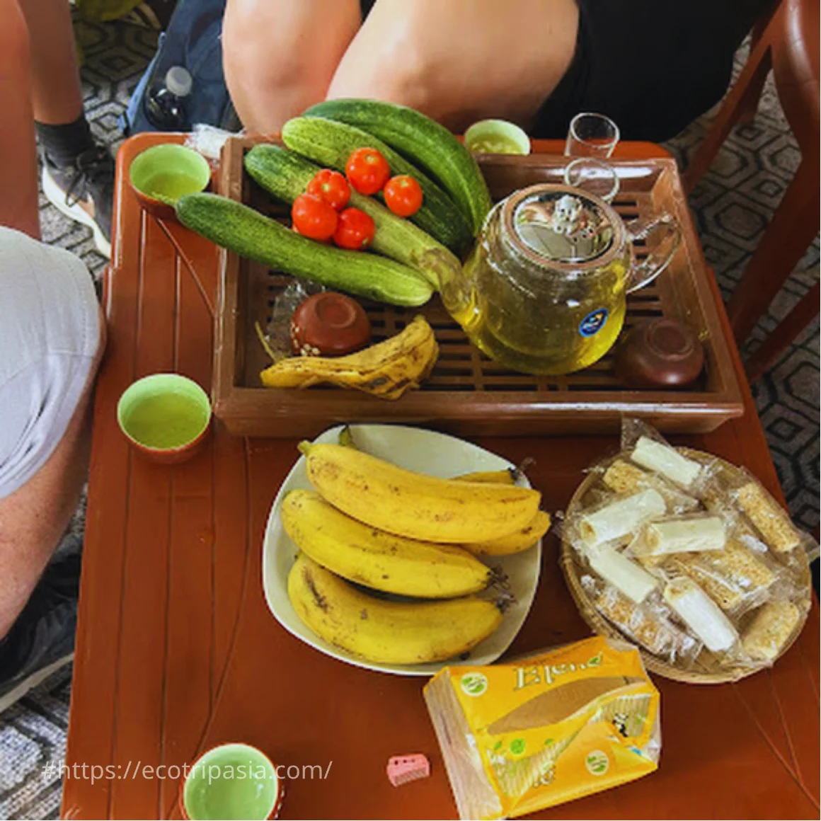 Tea And Fresh Fruit With Local People — hanoi city tour with female riders by Eco Trip Asia